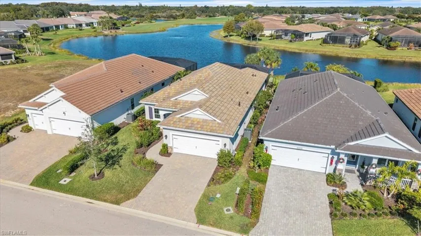 Aerial perspective of suburban area with a large body of water