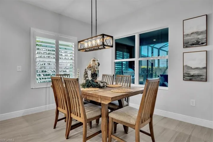 Dining room featuring wood finish floors and baseboards