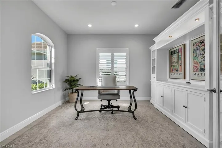 Office featuring baseboards and recessed lighting
