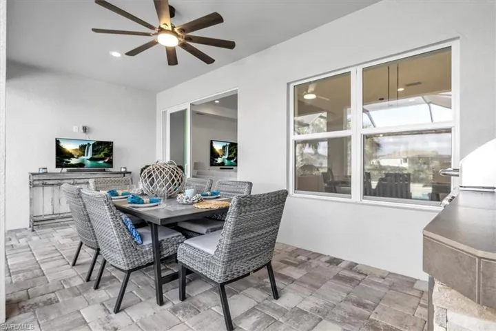 Dining area featuring a ceiling fan and recessed lighting