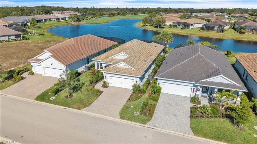 Aerial perspective of suburban area with a large body of water