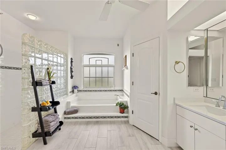 Separate soaking tub, glass shower