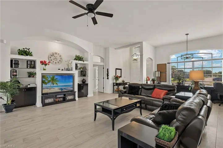 Living room with Double door entry into the foyer