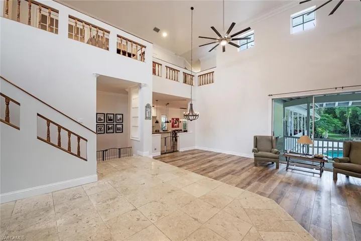 Soaring Ceilings at Entry with Views over the pool and yard