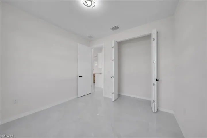 Unfurnished bedroom featuring baseboards