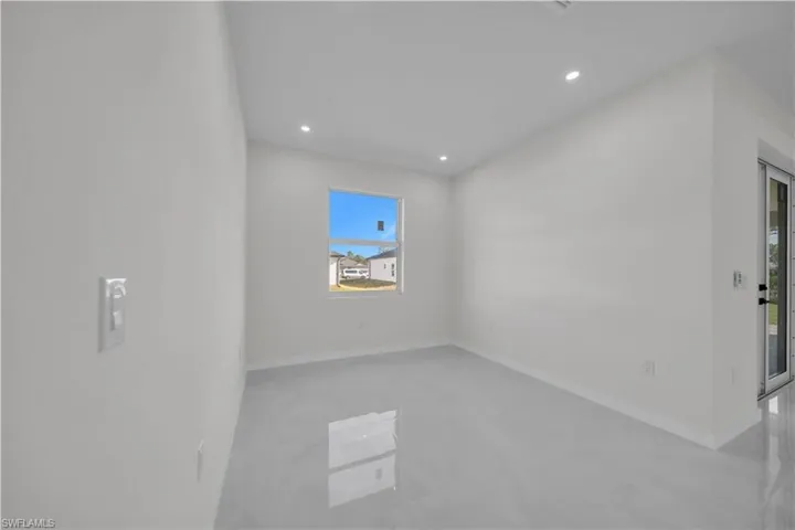 Unfurnished room featuring recessed lighting and concrete flooring