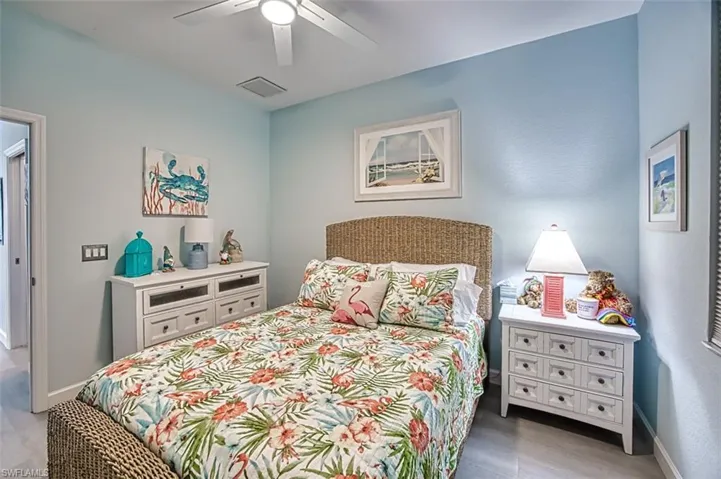 Bedroom featuring ceiling fan and hardwood / wood-style flooring