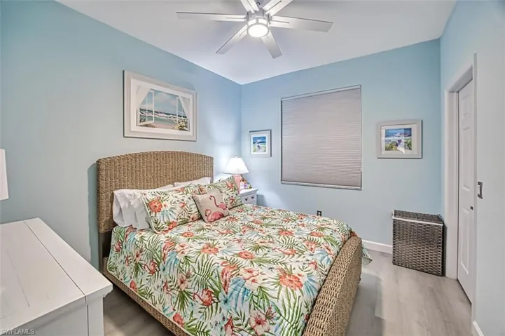 Bedroom featuring ceiling fan and hardwood / wood-style floors
