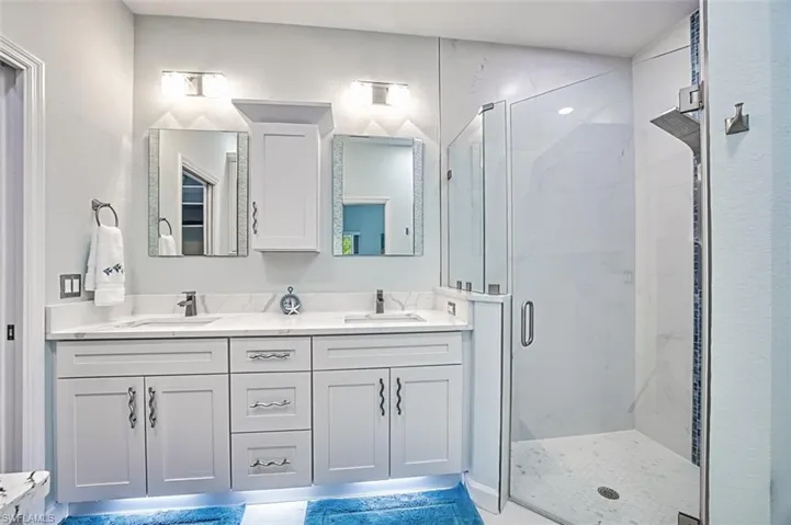 Bathroom with walk in shower and vanity