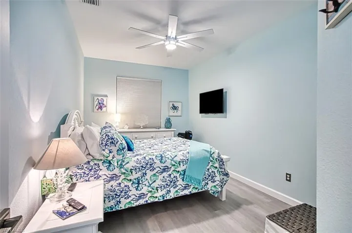 Bedroom featuring hardwood / wood-style floors and ceiling fan