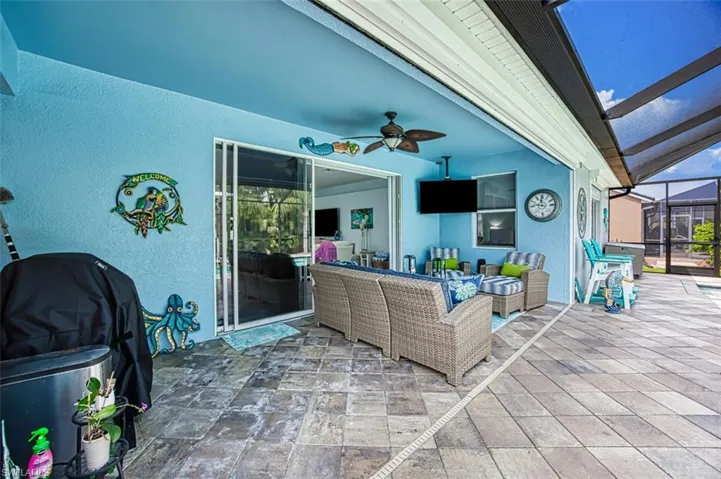 View of patio / terrace with glass enclosure, ceiling fan, outdoor lounge area, and area for grilling