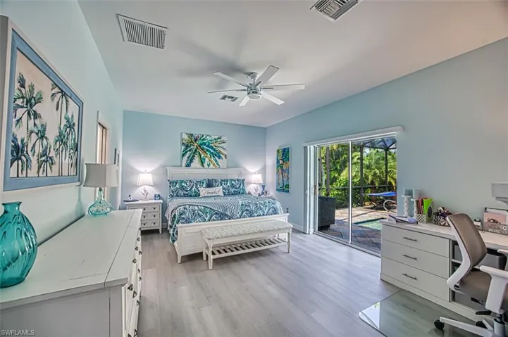 Bedroom featuring light wood-type flooring, access to outside, and ceiling fan
