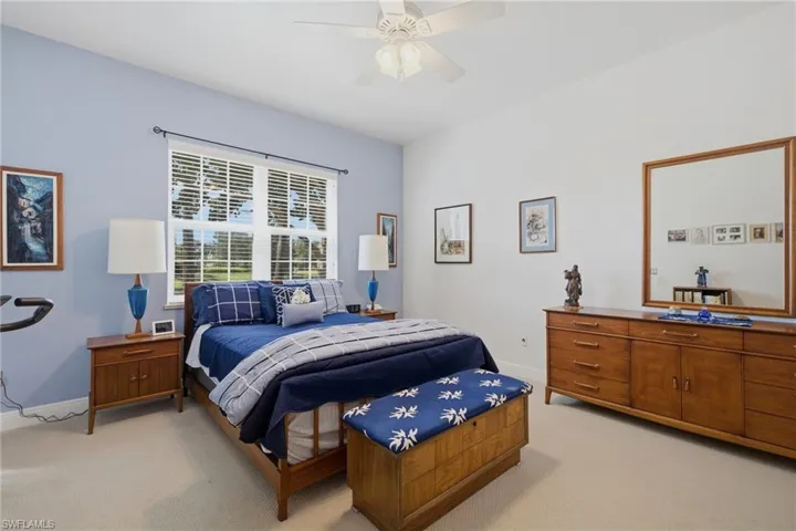 Primary Bedroom with Sliding Glass Doors to Screened Lanai