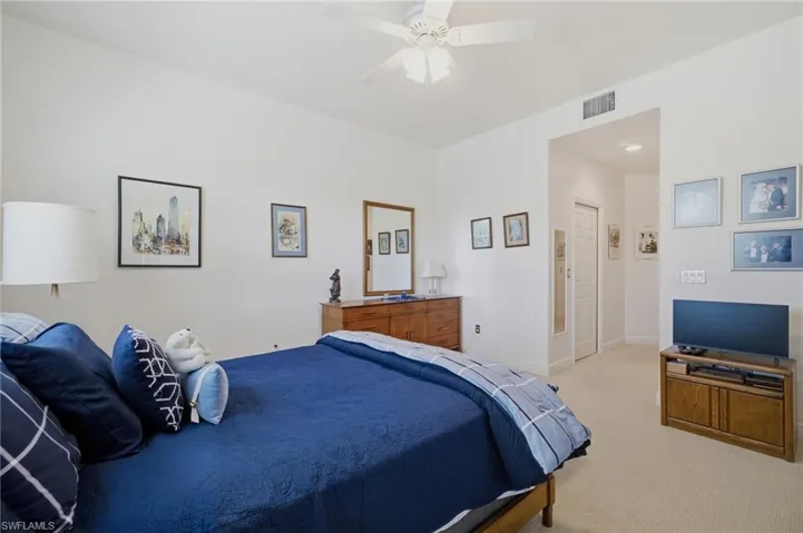 Primary Bedroom with Sliding Glass Doors to Screened Lanai