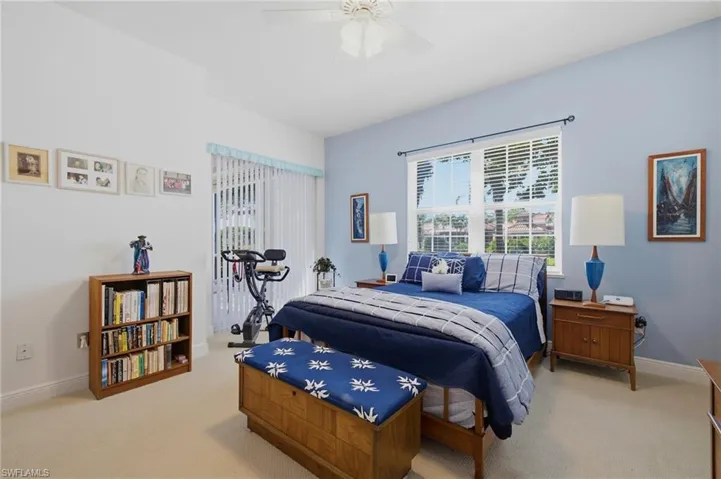 Primary Bedroom with Sliding Glass Doors to Screened Lanai