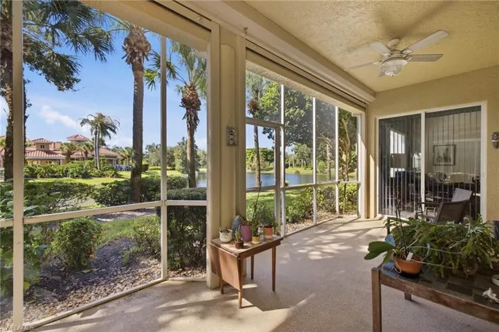 Lanai - View of lake, mature trees and clubhouse.