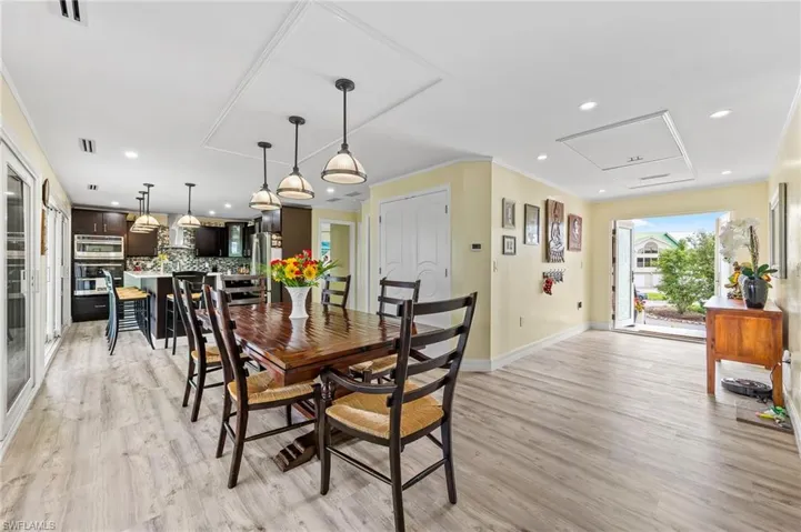 Huge dining area seating 14+ guests comfortably while looking over the bay