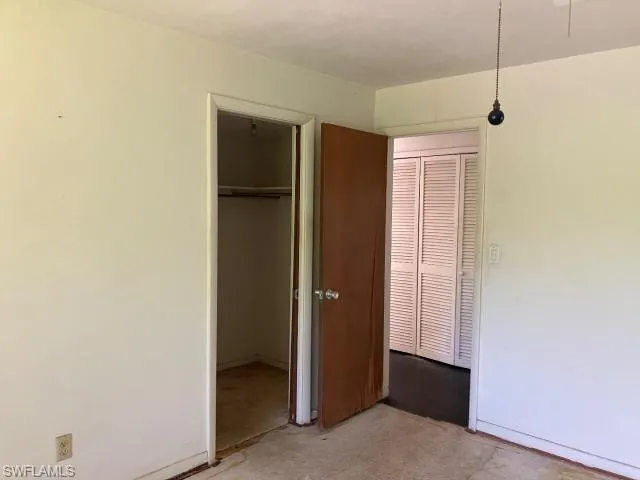 Unfurnished bedroom with a closet