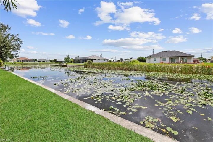 View of grassy yard featuring a water view