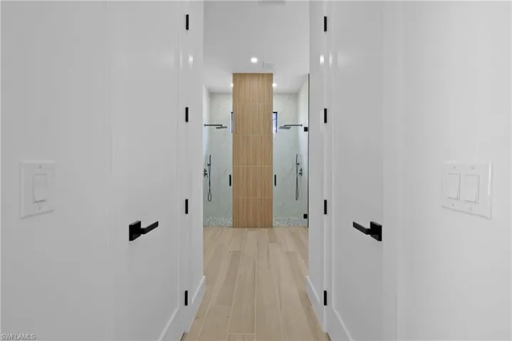 Corridor with recessed lighting and light wood-type flooring