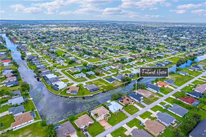 View of property location featuring nearby suburban area and a nearby body of water