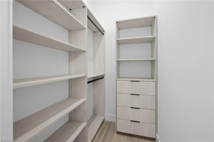 Walk in closet featuring light wood finished floors
