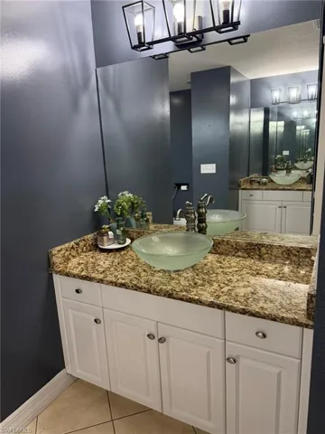 Bathroom with vanity and light tile patterned floors
