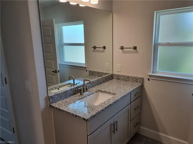 Bathroom featuring vanity and tile patterned floors
