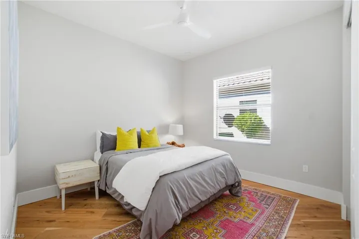 Bedroom with a ceiling fan and light wood finished floors
