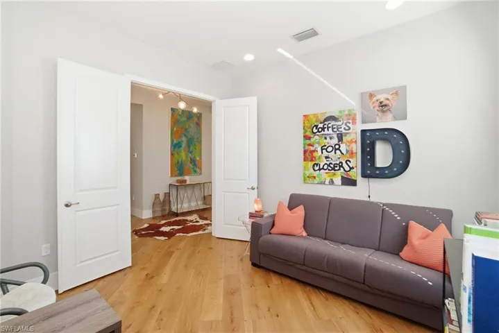 Living room with light wood-style flooring