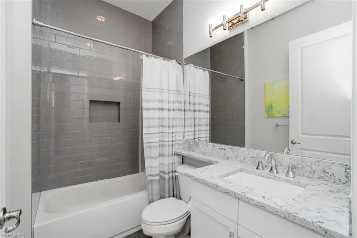 Full bath with shower / bath combo and vanity