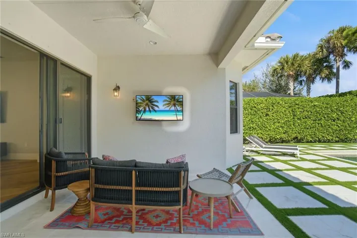 View of patio / terrace with a ceiling fan and outdoor lounge area