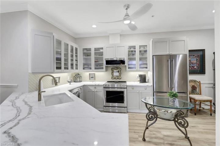 The veins in quartz are placed perfectly to achieve richness & balance. The cabinets have pull out shelving.