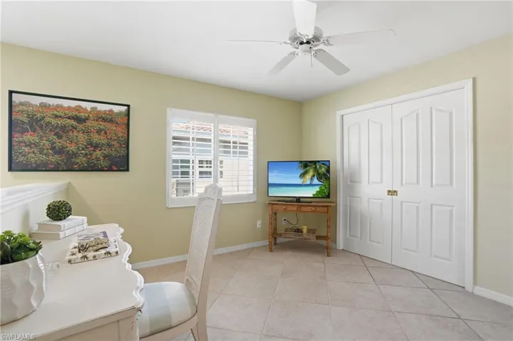 Neutral-toned walls complement the tiled flooring and white trim