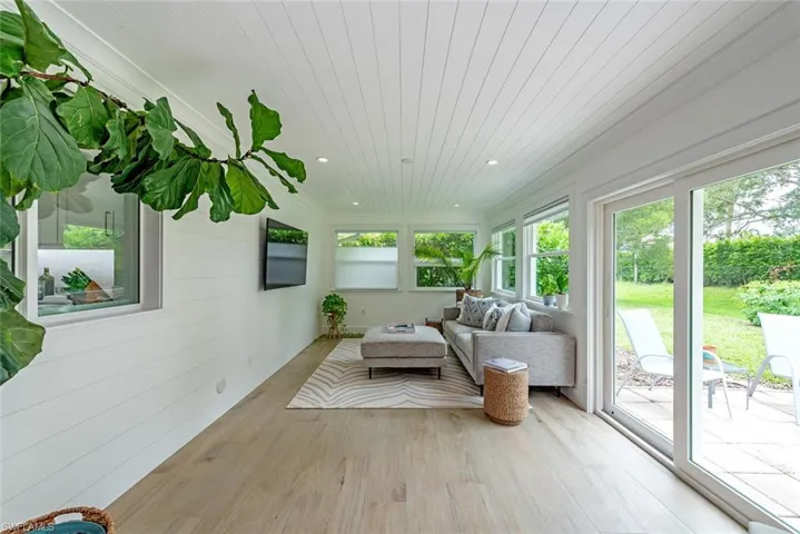 Sunroom featuring wood ceiling