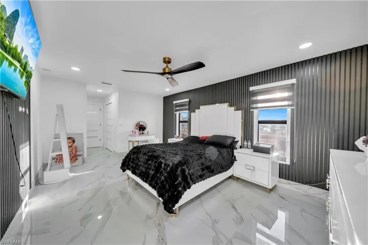 Bedroom with recessed lighting and a ceiling fan