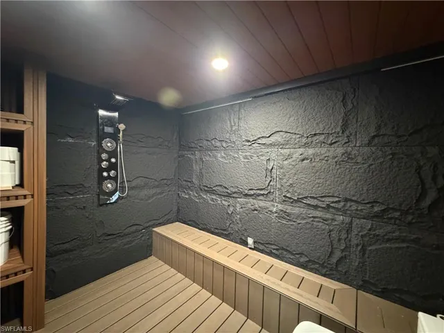 Sauna with recessed lighting and wood ceiling