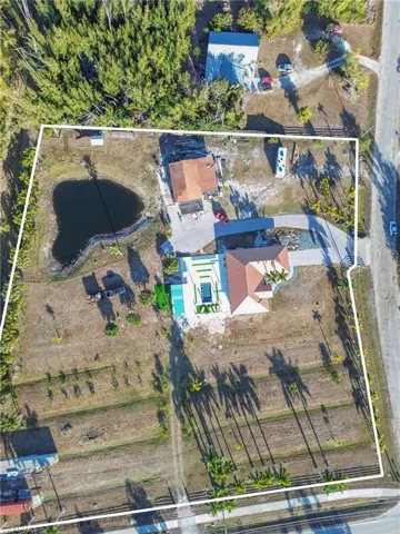 View of property location with property parcel outlined and a large body of water