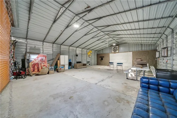 Garage featuring metal wall