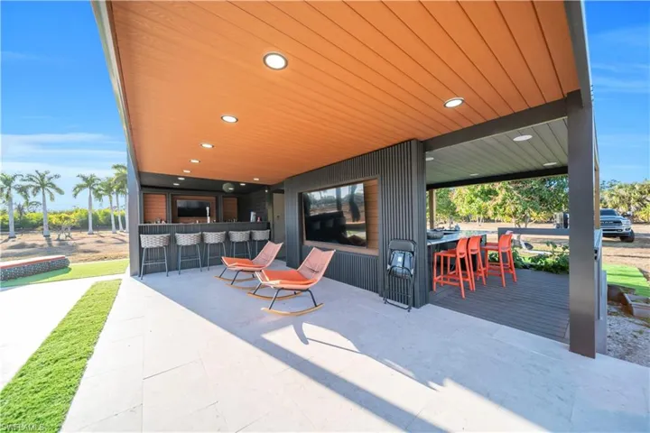 View of patio / terrace featuring an outdoor bar and dining area