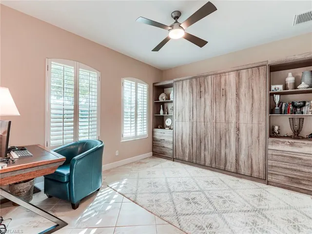 Guest bedroom with built in King-size Murphy Bed easily converts to office space.
