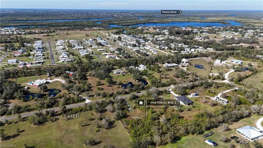 Drone photo looking northwest with the Peace River in the distance.