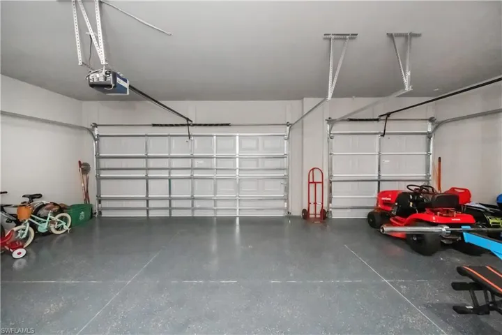Garage featuring a garage door opener