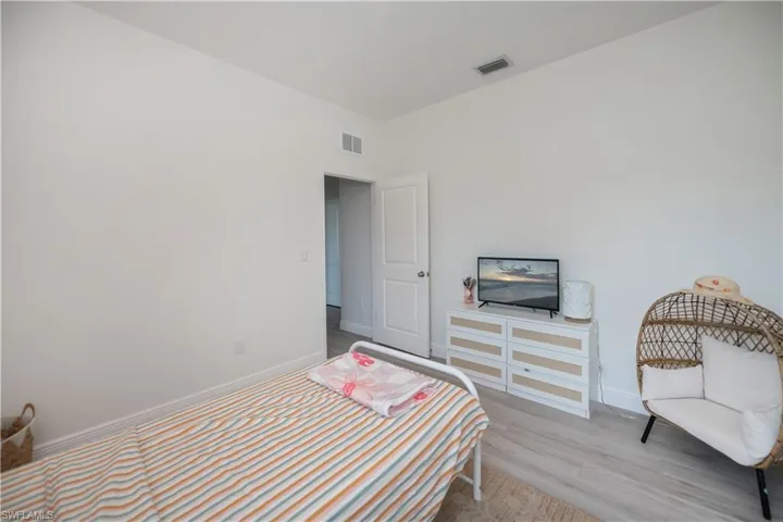 Bedroom with baseboards and light wood-style flooring