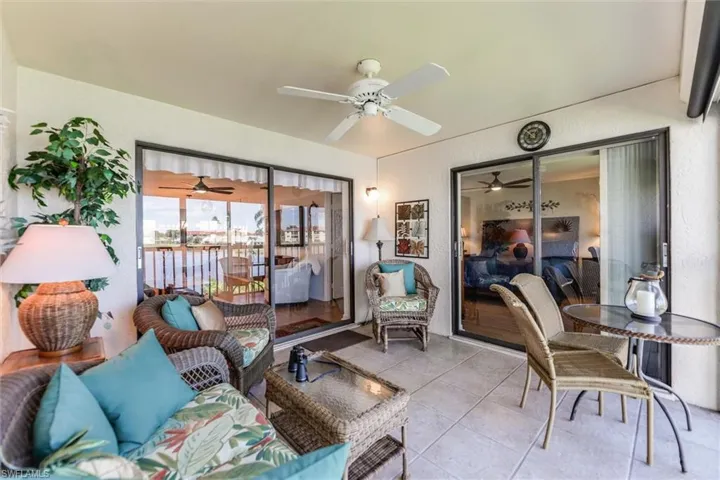 Enclosed Lanai  / solarium featuring a patio area and ceiling fan