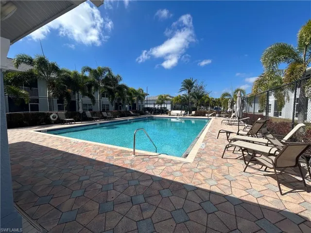 Community pool featuring a patio area