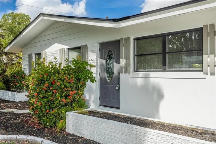 Property entrance with stucco siding