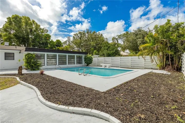 View of pool featuring a patio area, a fenced backyard, and a fenced in pool