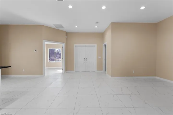 Spare room with recessed lighting and light marble finish flooring