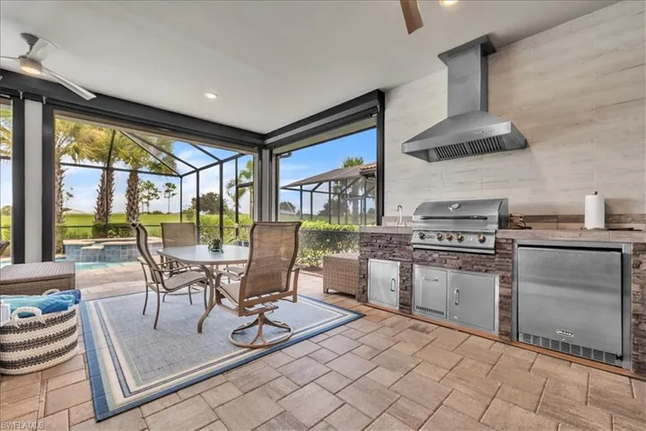 Lanai with 4' extension, outdoor kitchen and STORM SMART BLINDS
